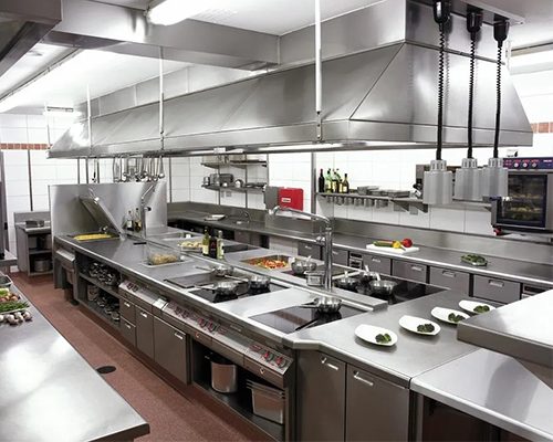 Commercial restaurant kitchen with stainless steel equipment